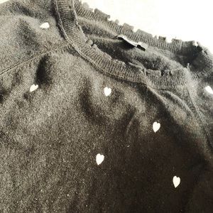 SMALL black distressed sweater with white hearts
